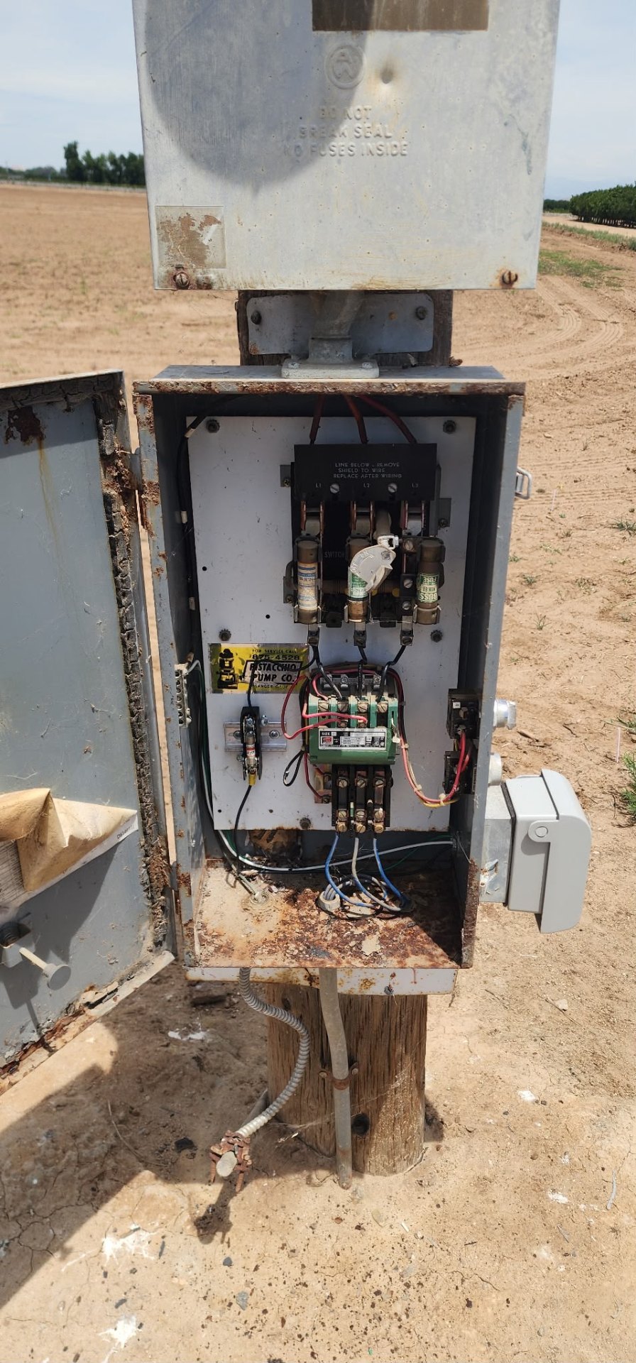 Rusted pump control being serviced