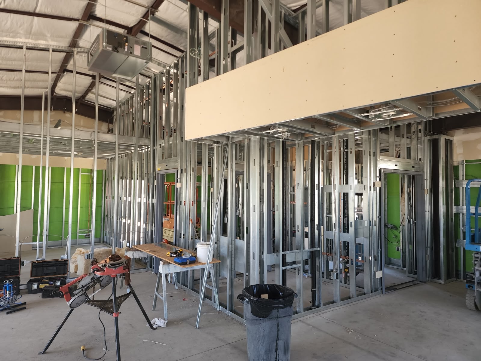 Commercial interior mid-buildout with metal framing
