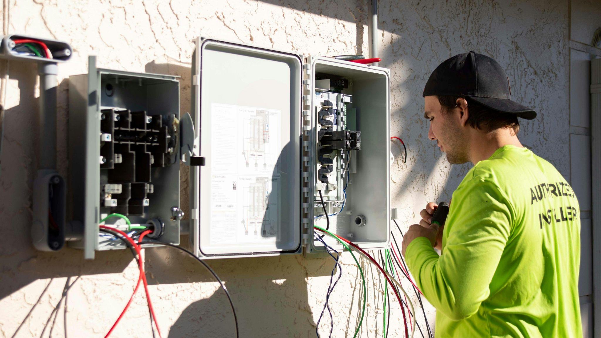 Technician completing an electrical diagnosis in Central Valley on an outdoor electrical system.
