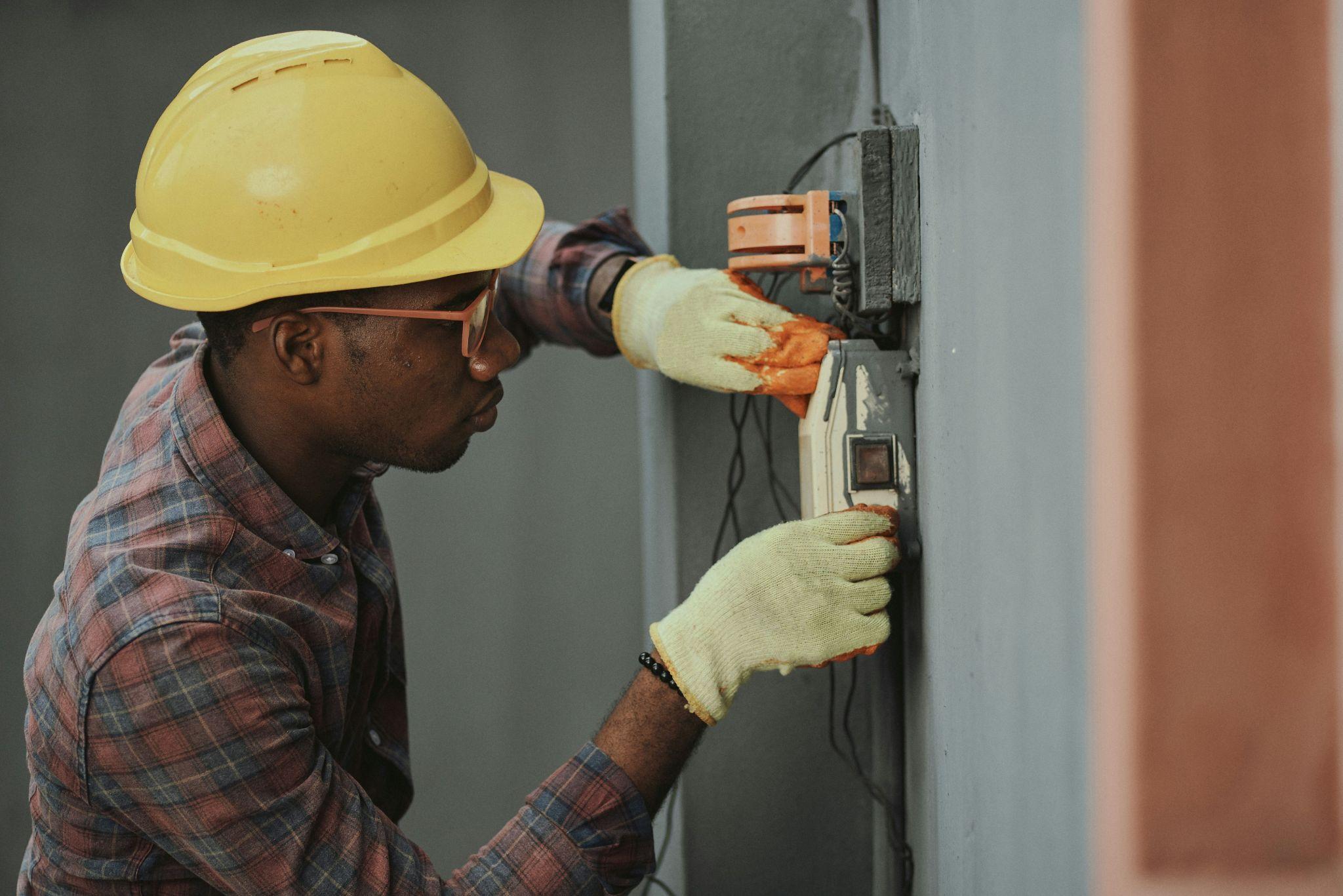 Electrician performing electrical problem diagnosis in Central Valley on electrical equipment.