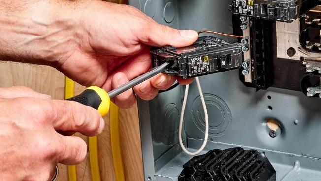 Residential electrical panel inspection before electrical breaker replacement in Central Valley