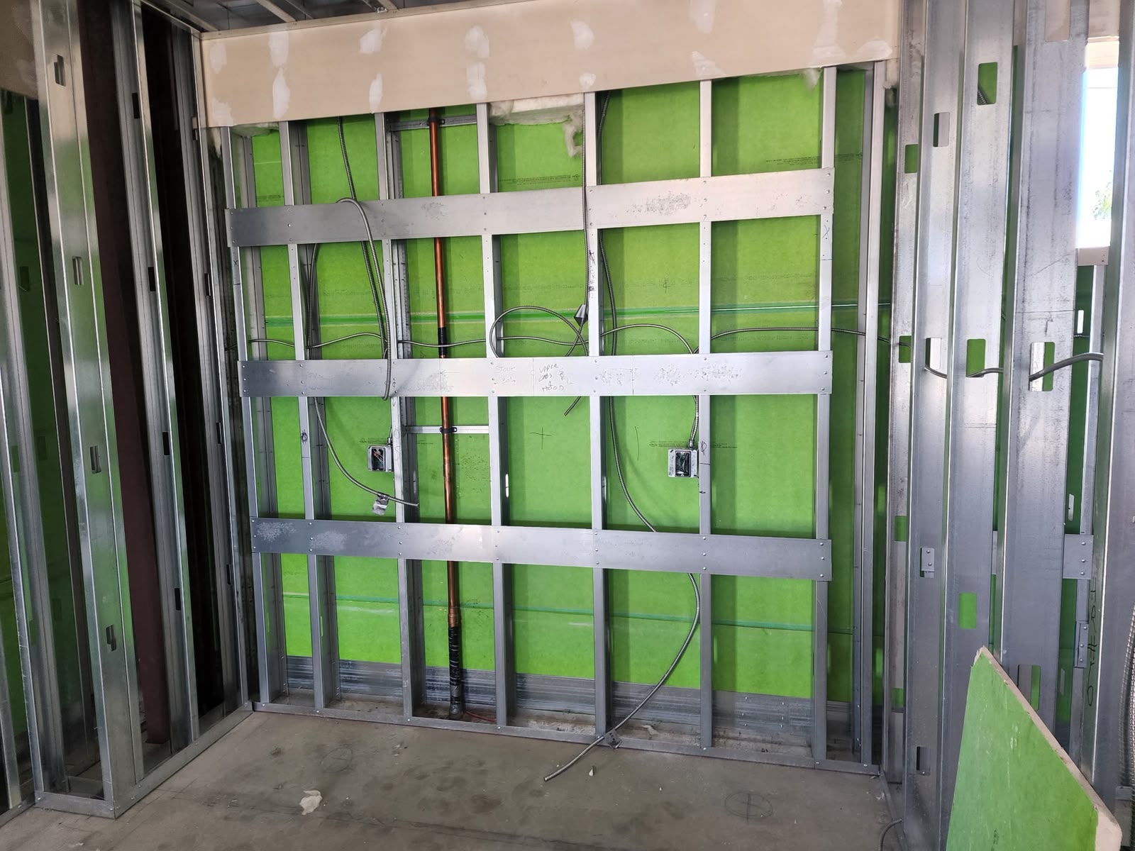 Electrical rough-in with green insulation and conduit
