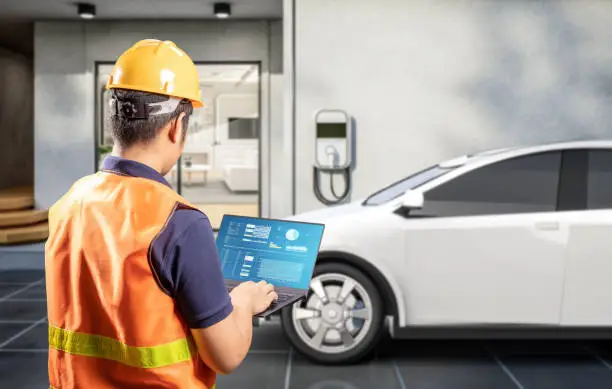 EV charger installer in Central Valley checking electrical panel capacity